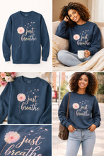 Load image into Gallery viewer, Woman wearing a navy blue “just breathe” self-care crewneck sweatshirt in cozy and everyday lifestyle settings.
