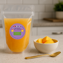 Load image into Gallery viewer, 12oz Mango Flavored Sea Moss with Golden spoon and a small bawl of chopped mango
